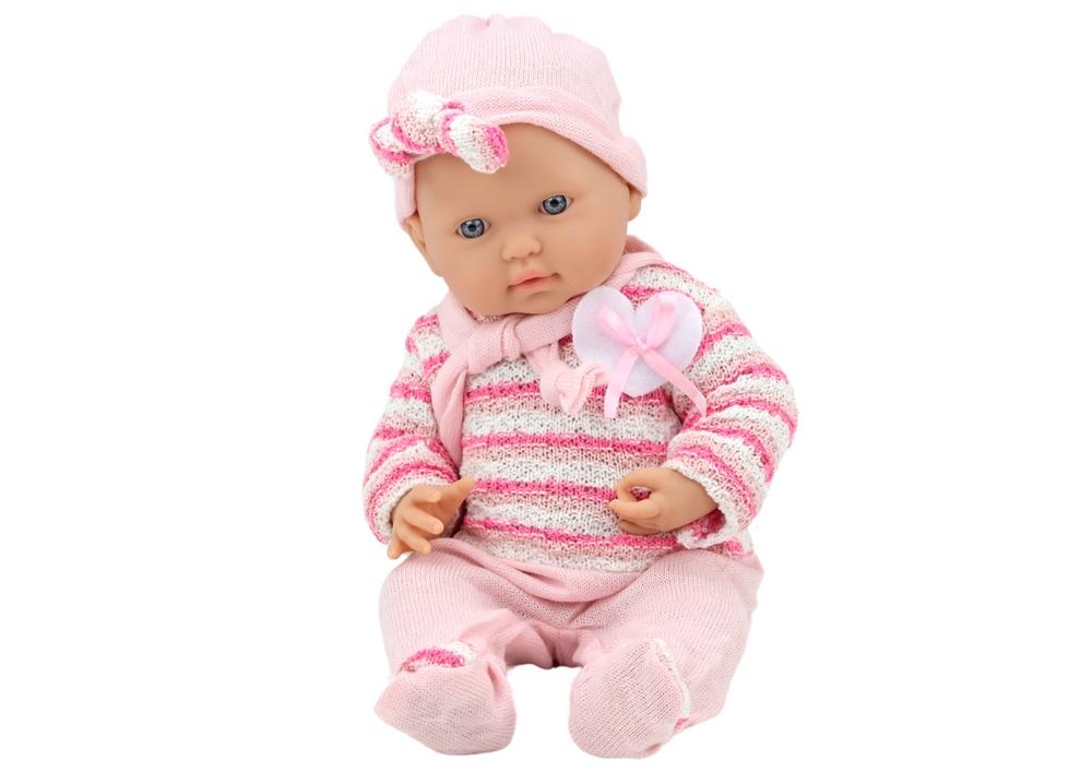 Charmerende babydukke i pink outfit med stribet sweater